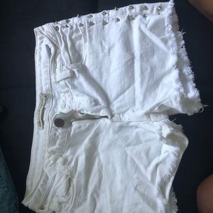 White Shorts with spikes at the side.